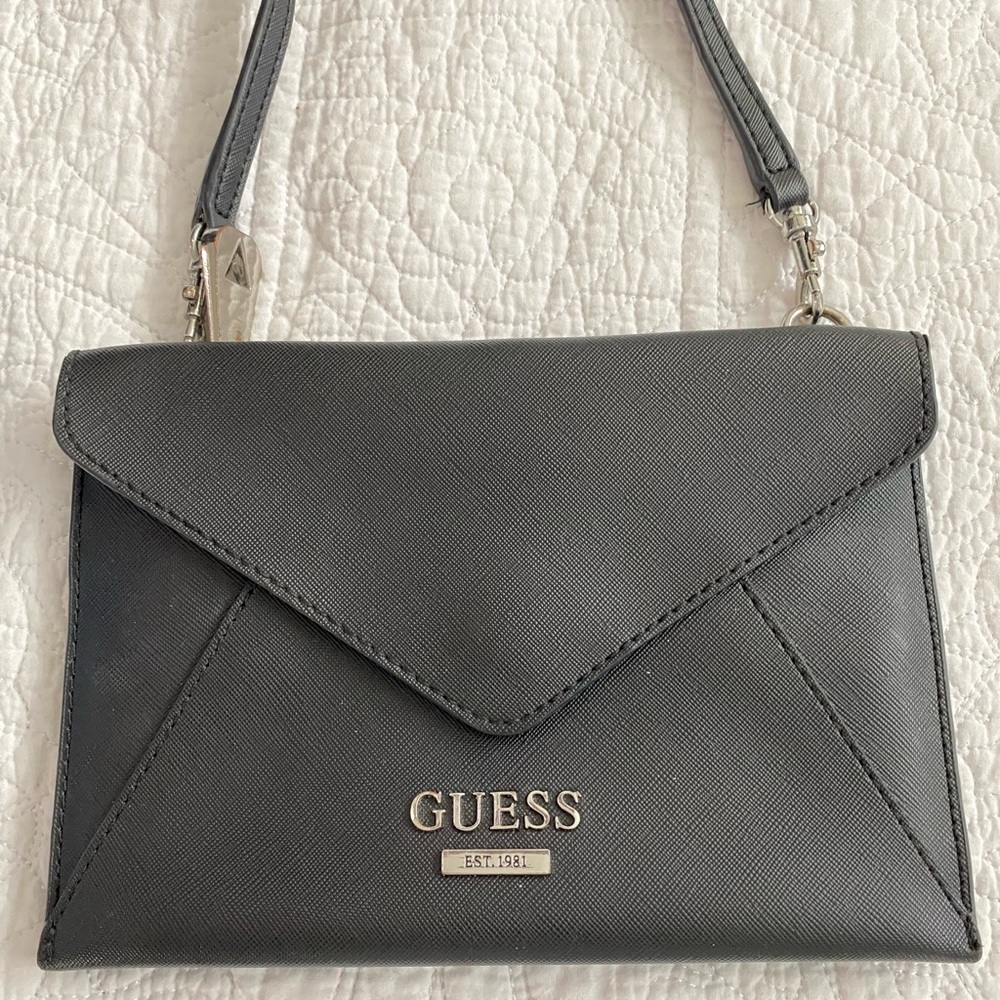 Guess brand clutch. Black clutch. Perfect conditions